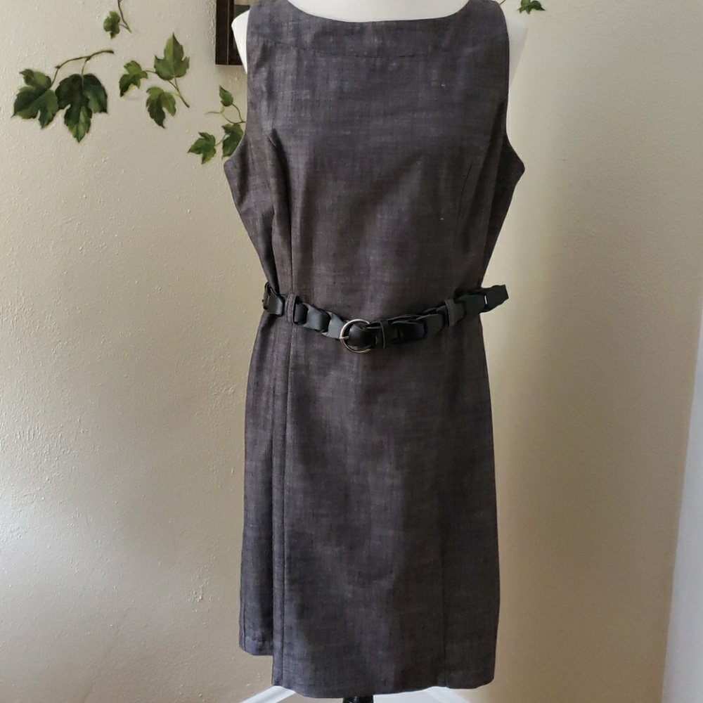 Sleeveless woven belted dress .